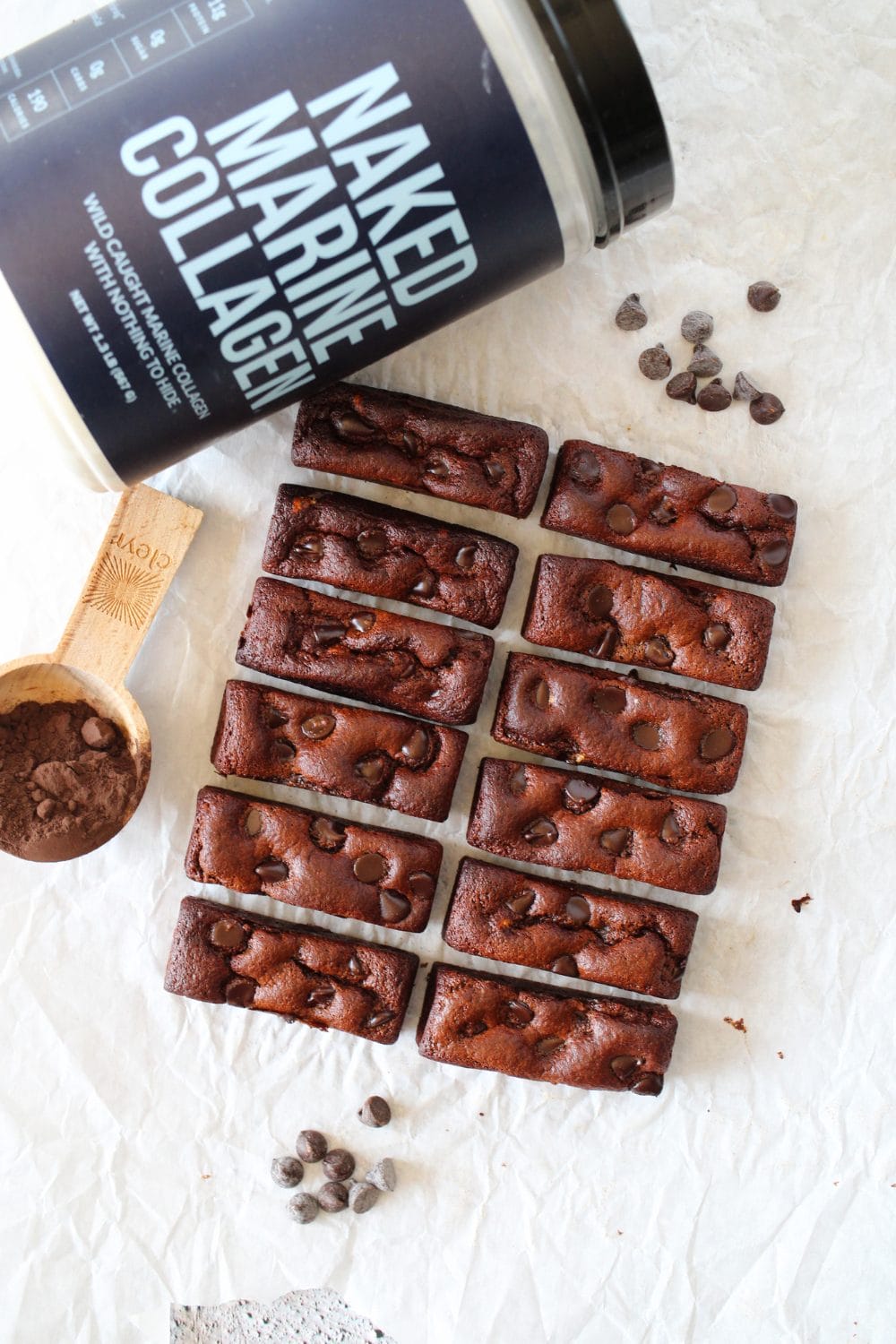 collagen baked brownie protein bars with powdered unsweetened cocoa powder and chocolate chips scattered