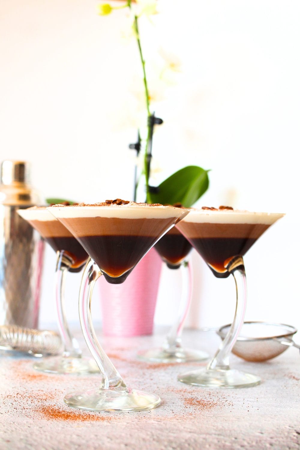 front view of keto coffee mousse layered dessert served in martini glasses