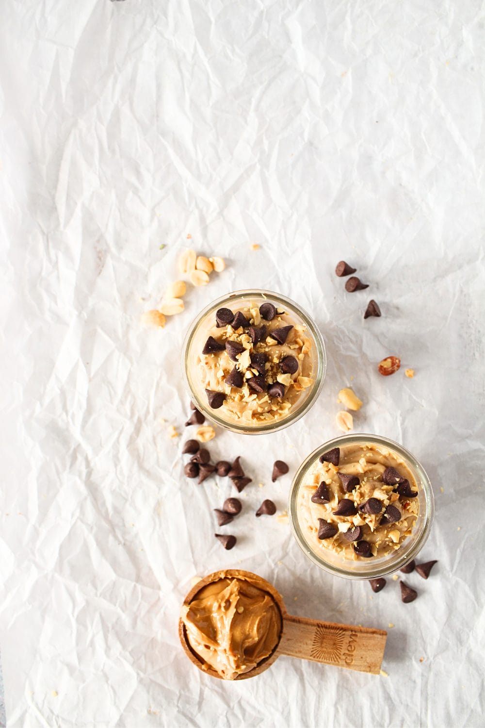 top view of keto peanut butter mousse with a spoon full of peanut butter