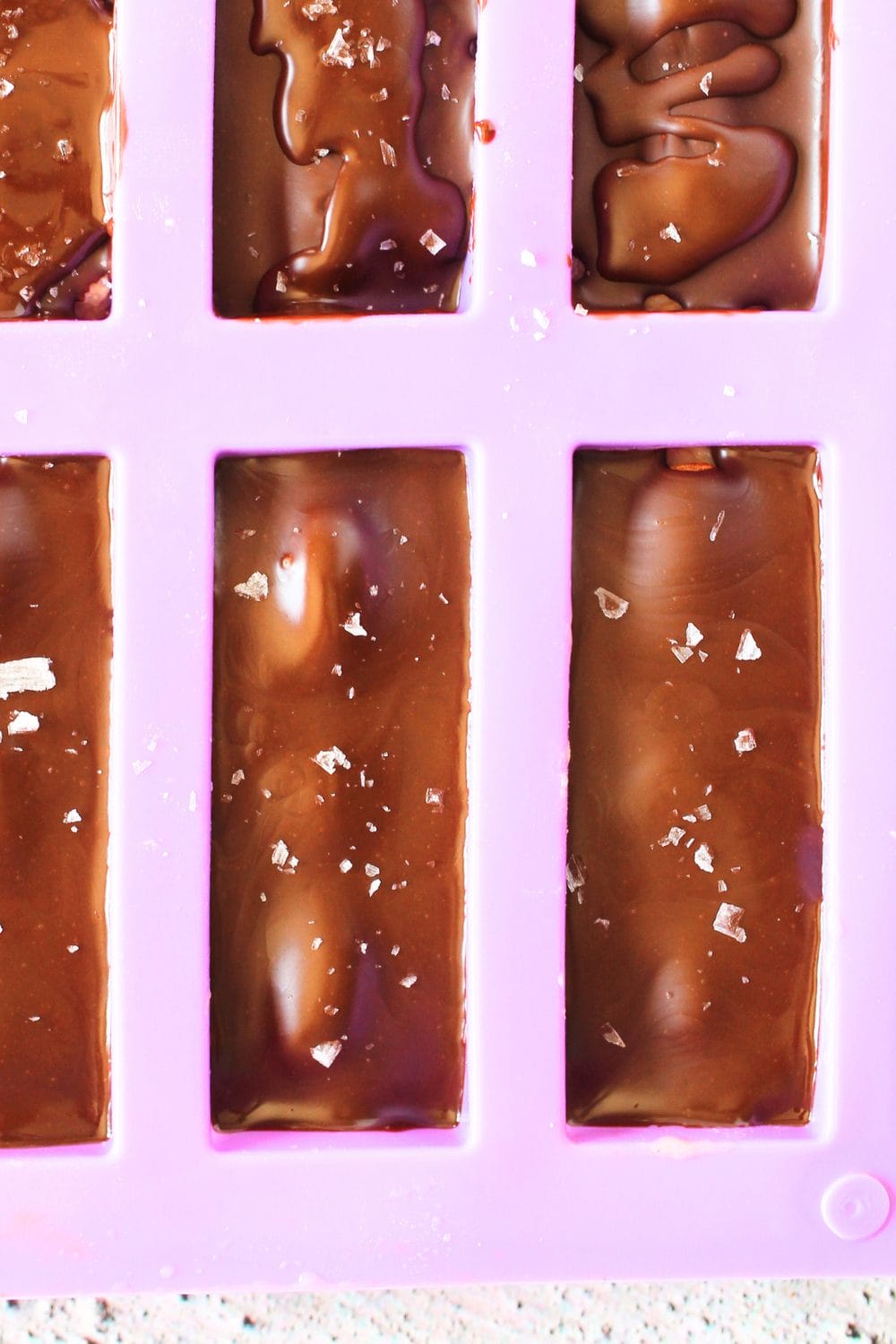 top view of protein mold with copycat keto almond joy with added maldon salt