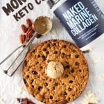 top view of keto collagen cookie with a tub of naked marine collagen and a cookie scoop