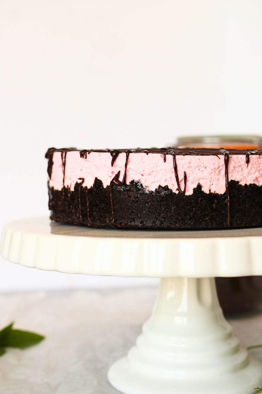 side view of no-bake keto cheesecake recipe made with strawberries and chocolate