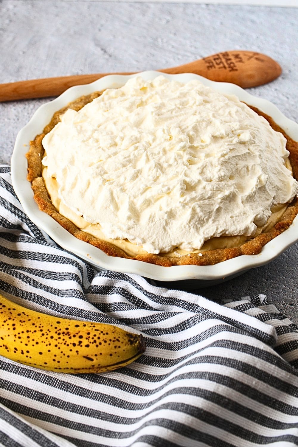 front view of keto banana cream pie with sugar-free whipped topping