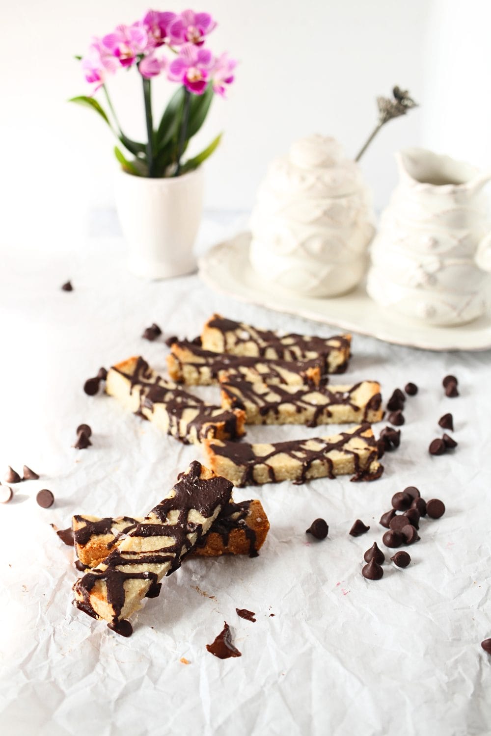 front view of keto shortbread bars wtih chocolate chips scattered around the bars