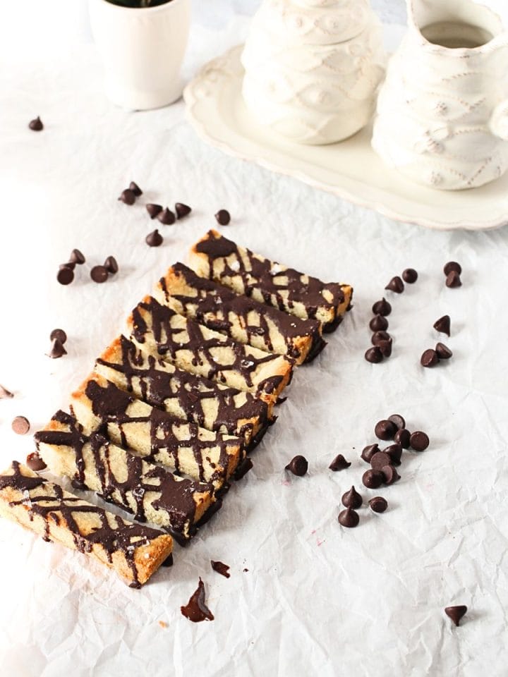 front view of keto shortbread bars wtih chocolate chips scattered around the bars