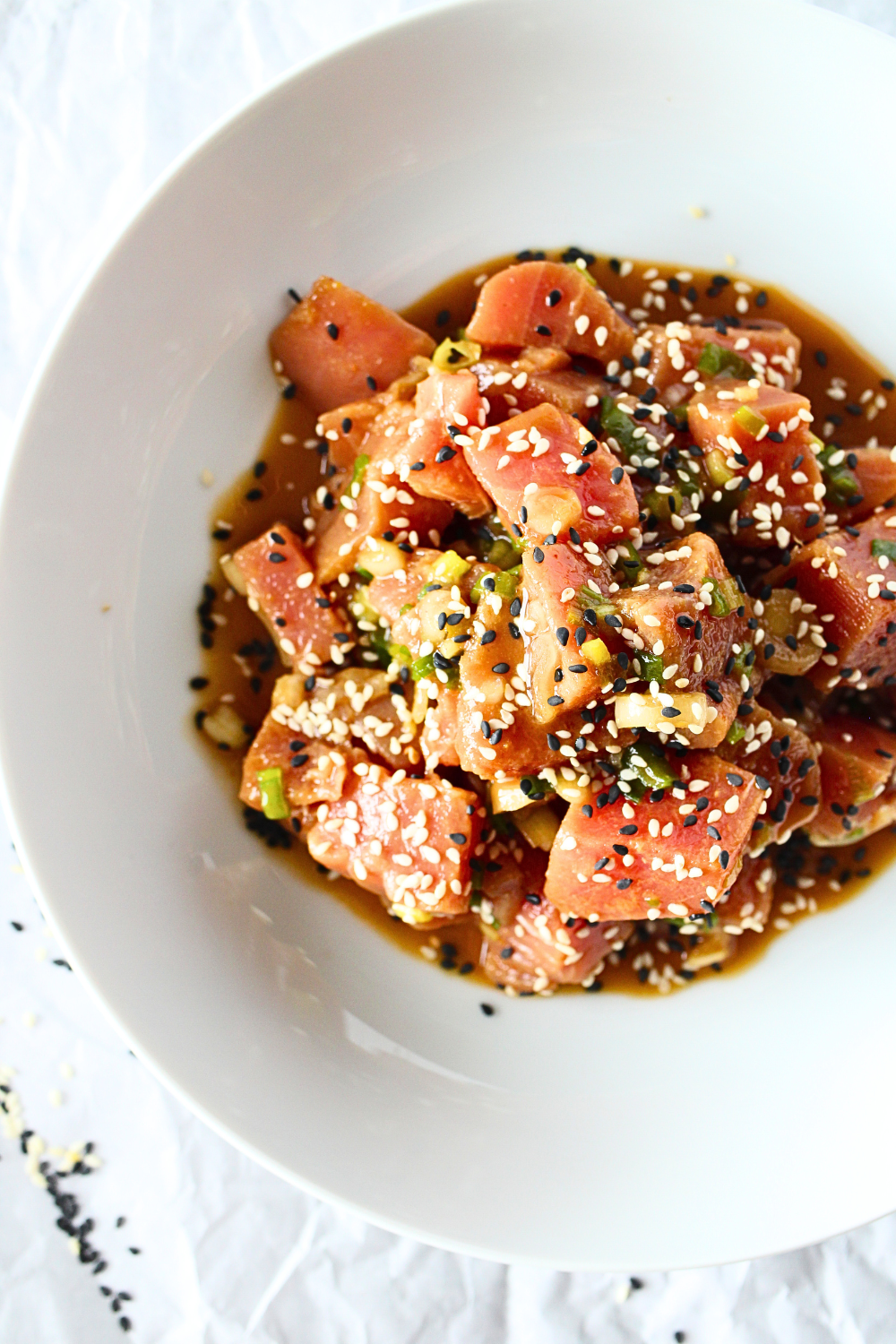 top view of healthy poke bowl with sesame seeds