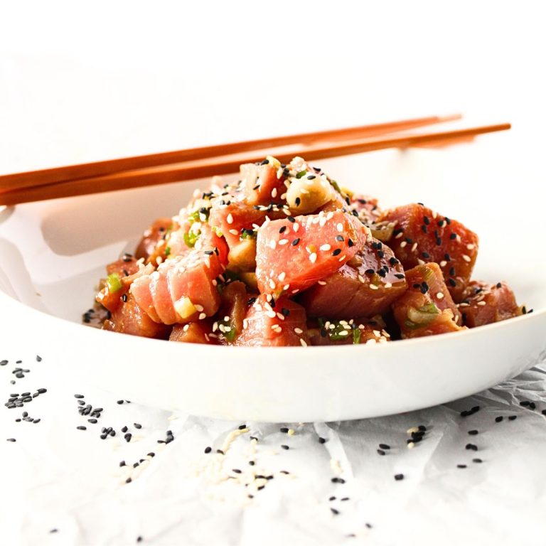 front view of easy keto poke bowl with chopsticks and sesame seeds