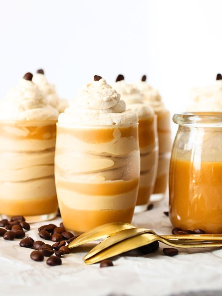 front view of keto frozen mousse cups with whipped cream and espresso beans