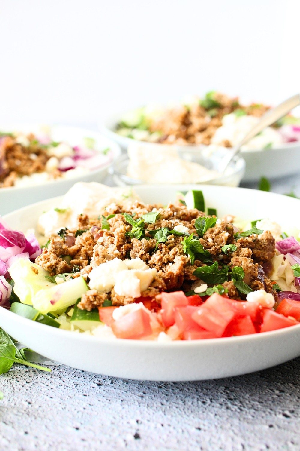 front view of healthy kofta bowl with fresh herbs