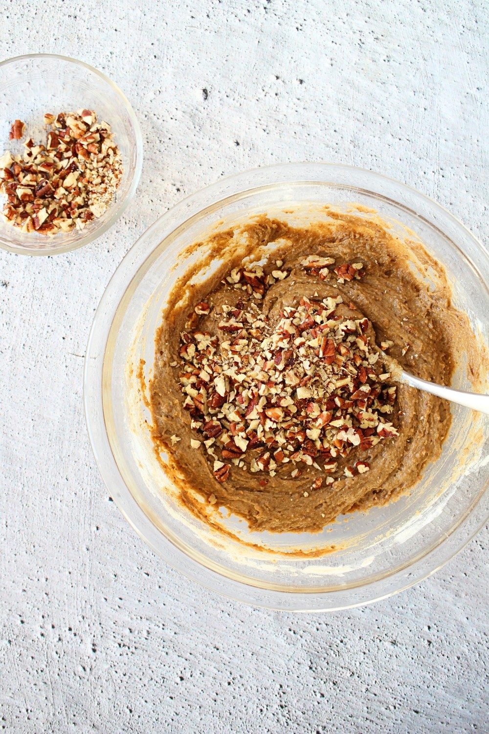 top view of healthy keto blondies with nuts being mixed in