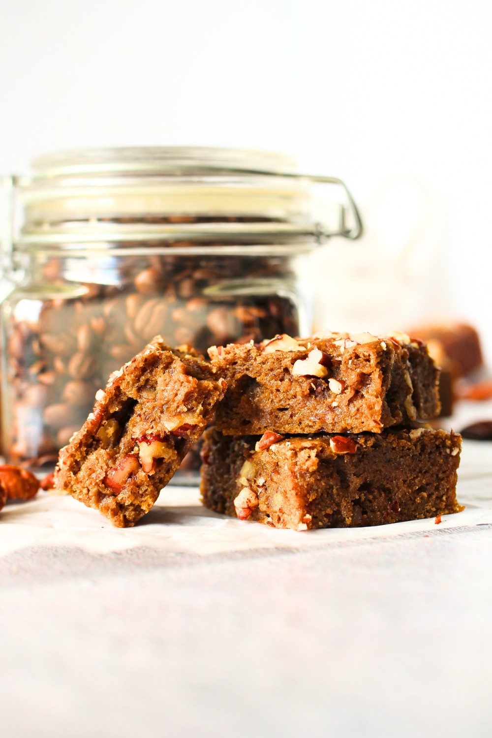 keto high fiber bars stacked on top of each other with espresso beans in the background
