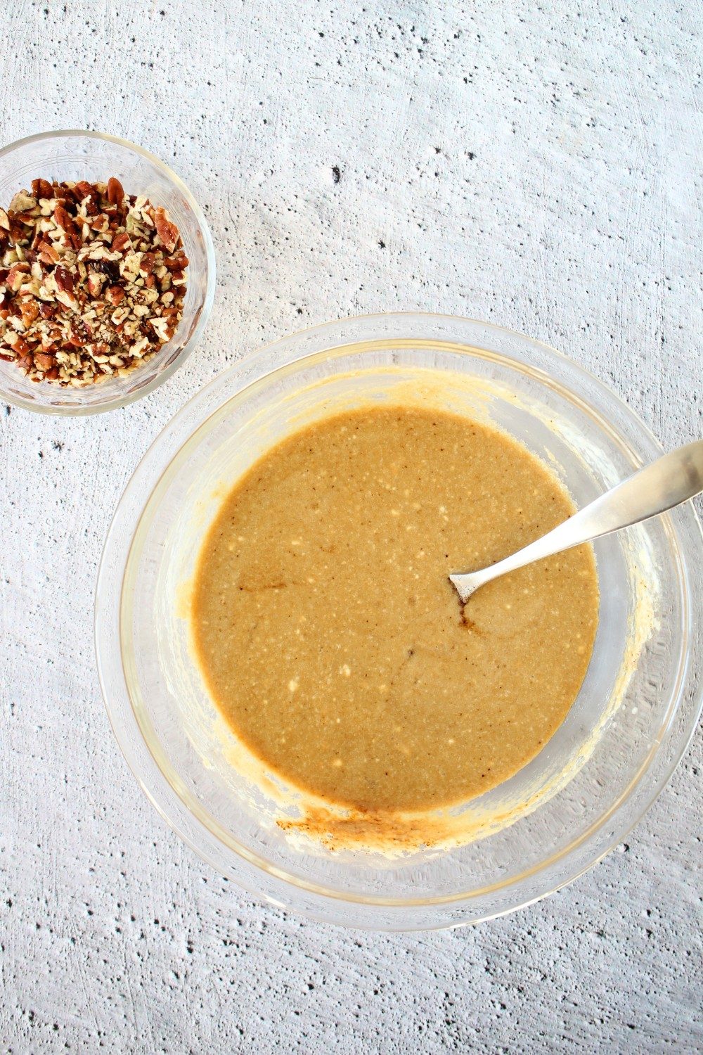 top view of wet ingredients whisked together in a bowl for making keto coffee nut blondies