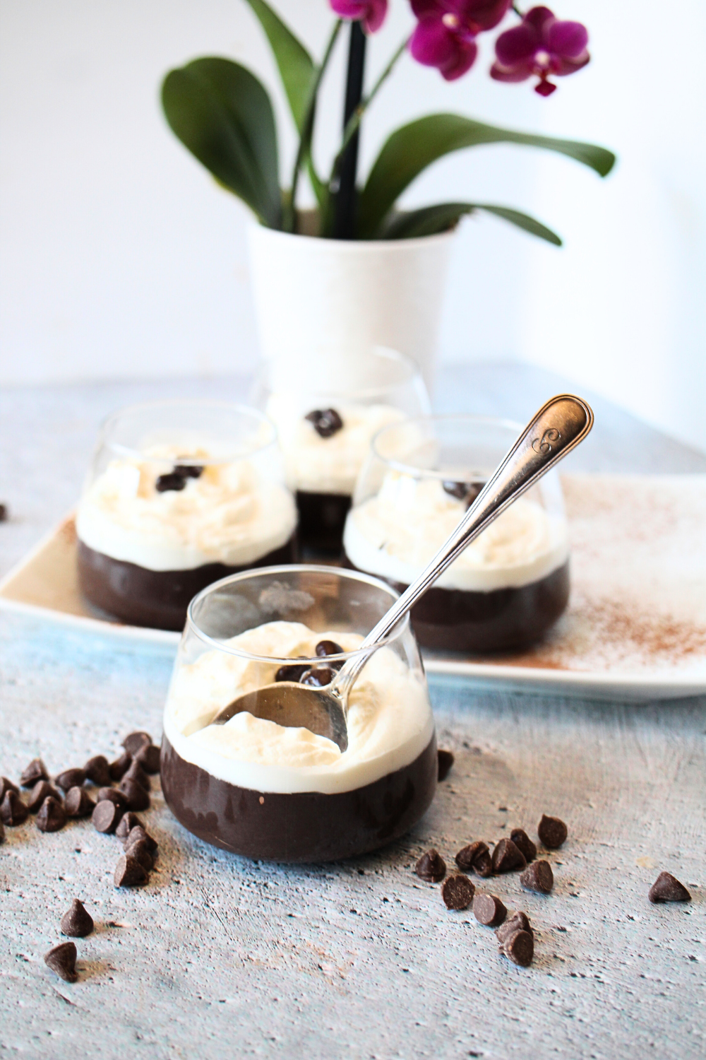 high protein pudding in cups with a spoon